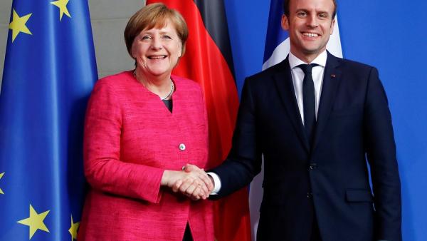 Angela Merkel e Emmanuel Macron. Foto: Simone Fontana/Flickr