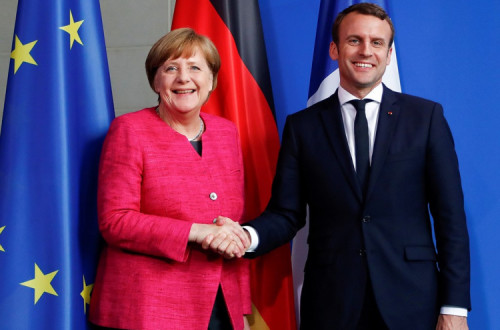 Angela Merkel e Emmanuel Macron. Foto: Simone Fontana/Flickr