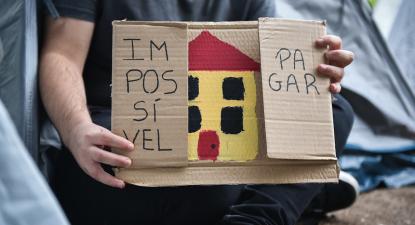 Cartaz com desenho de uma casa e onde se lê "Impossível pagar".