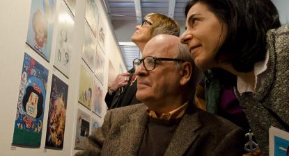 “[Teresa] Parodi [ministra da Cultura da Argentina em 2014] percorreu com Quino a exposição de homenagem aos 50 anos de Mafalda”, Ministério da Cultura da Argentina, foto licenciada sob CC BY-SA 2.0